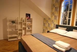a bedroom with a large bed and a window at NEW Apartment in Berindey Villa - Historical Center, Universitate in Bucharest