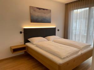 A bed or beds in a room at Apartments Johanna