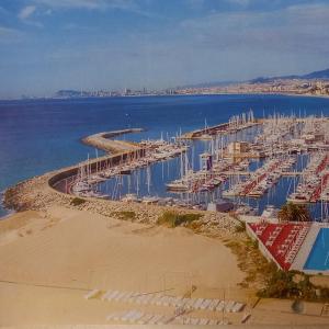 a group of boats docked in the water at Lydia's Port Nautic & Beach in El Masnou