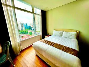 מיטה או מיטות בחדר ב-Vortex suites near by KLCC
