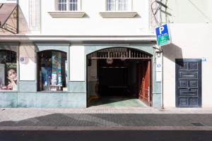 a building with a door leading into a store at Rooms & Suites Loft 2G Deluxe Edition Arrecife in Arrecife