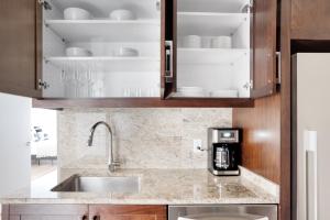 a kitchen with a sink and a coffee maker at Back Bay Studio w WD Gym Roof nr Copley Sq BOS-752 in Boston