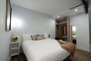 Center Suite Acebedos客房内的一张或多张床位