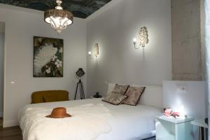 Center Suite Acebedos客房内的一张或多张床位