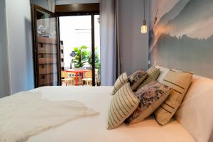 Center Suite Acebedos客房内的一张或多张床位