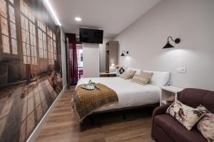 Center Suite Acebedos客房内的一张或多张床位