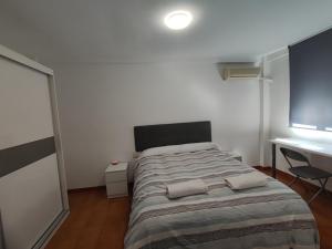 Ένα ή περισσότερα κρεβάτια σε δωμάτιο στο Alojamiento La Paz