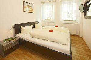 Postel nebo postele na pokoji v ubytování Dünenresidenz mit Meerblick + 8 fotografií