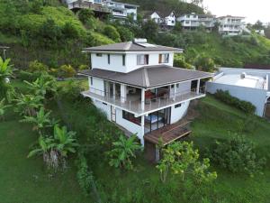an aerial view of a house on a hill at Manapiti on the hill in Papeete