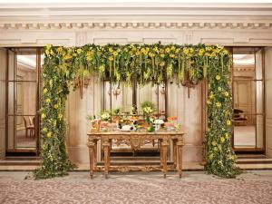 an altar with a table with flowers on it at Le Meurice – Dorchester Collection in Paris