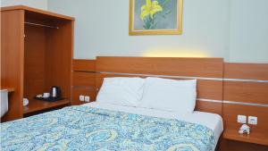 Letto o letti in una camera di Gaia Asri Hotel