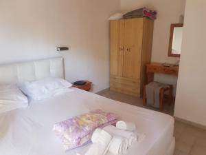 Postel nebo postele na pokoji v ubytování Kaiti Villa 4