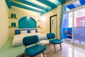Giường trong phòng chung tại GJia Taitung B&B