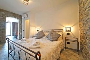 a bedroom with a large bed in a room at Villa Viola 12 pax family retreat pool near 5Terre in Aulla