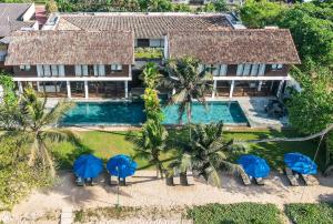 an aerial view of a villa with a swimming pool at Ubuntu Beach Villas by Reveal in Mirissa