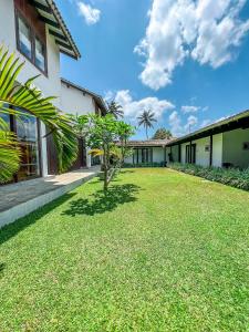 A garden outside Ubuntu Beach Villas by Reveal