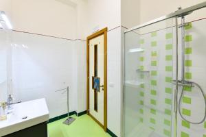 a bathroom with a glass shower and a sink at La casa del Conte - Amalfi Coast in Amalfi +15 photos