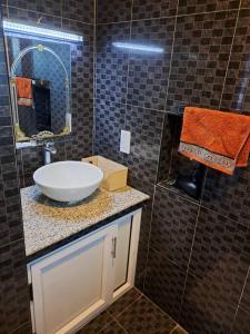 Et badeværelse på SEASIDE HAVEN KEI BHarmony Appartments