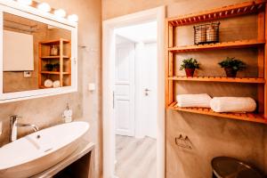 a bathroom with a sink and a mirror at Melos House in Zakynthos Town