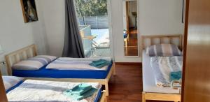 A bed or beds in a room at Dimai House No 15 Dornbirn Zentrum