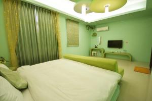 Giường trong phòng chung tại GJia Taitung B&B