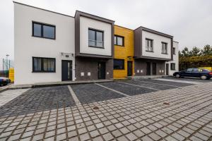 a row of houses in a parking lot at Apartament Premium in Rzeszów