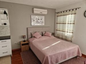 Postel nebo postele na pokoji v ubytování Apartments Ozrenka