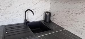 Kuchyň nebo kuchyňský kout v ubytování Apartments Ozrenka