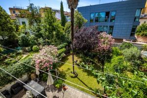 an overhead view of a garden with flowers and plants at YiD Capo di Mondo Luxury apartment in florence in Florence