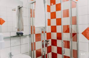 a bathroom with a shower and a toilet at Amalthea Sivota in Sivota