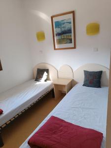 Posteľ alebo postele v izbe v ubytovaní Appartement A proximité d'Ax les thermes