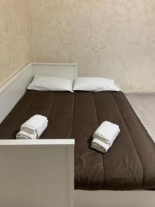 Giường trong phòng chung tại Vittorio Emanuele house