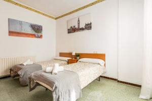 Postel nebo postele na pokoji v ubytování Hostal La Marina