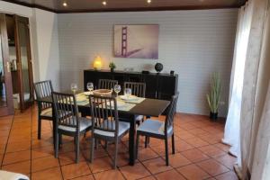 a dining room with a table and chairs at GuestReady - Charming accents near the beach in Sesimbra