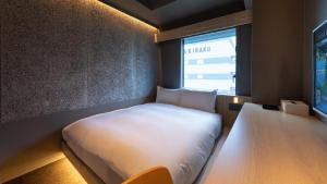 Ένα ή περισσότερα κρεβάτια σε δωμάτιο στο Onn Yuda Onsen
