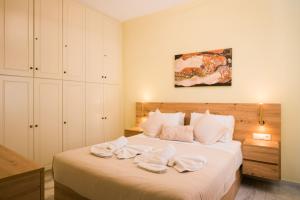 En eller flere senge i et værelse på Loggia Ηome