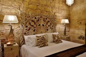 Postel nebo postele na pokoji v ubytování Chapel 5 Boutique Suites B&B