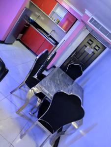 an overhead view of a table and chairs in a room at Golden tulips festival mall in Lagos