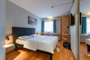 Postel nebo postele na pokoji v ubytování ibis Köln Frechen