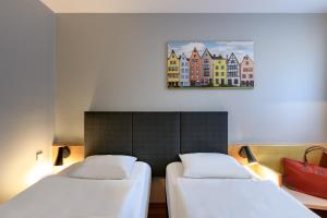Postel nebo postele na pokoji v ubytování ibis Köln Frechen