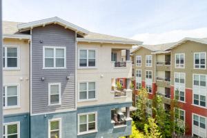 a row of apartment buildings at San Bruno 1BR w Pool Gym WD nr highways SFO-996 in San Bruno