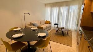 Posedenie v ubytovaní Les Papillons du Ventoux - Le Myrtil- éénslaapkamerappartement met terras en tuin
