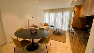 Kuchyňa alebo kuchynka v ubytovaní Les Papillons du Ventoux - Le Myrtil- éénslaapkamerappartement met terras en tuin