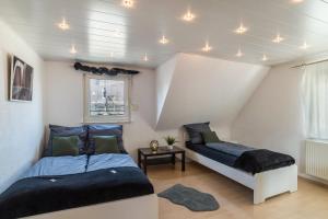 a bedroom with two beds and a window at am Hirnach in Sindelfingen