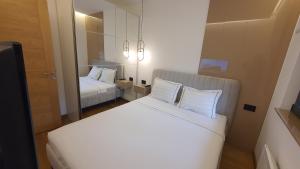 Postel nebo postele na pokoji v ubytování Lazarevic Lux - Vila Pekovic