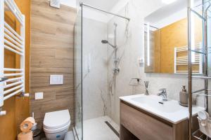 a bathroom with a shower and a toilet and a sink at Luxury Ambiance in Voluntari +70 photos