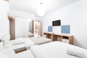 Ένα ή περισσότερα κρεβάτια σε δωμάτιο στο Il Magnifico