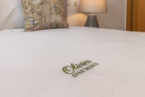 a close up of a bed with a sign on it at Olivier Premium Apartments - Downtown Lisbon in Lisbon