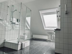 Ein Badezimmer in der Unterkunft AvidonApartments