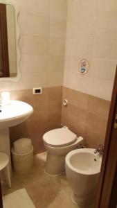 a bathroom with a toilet and a sink at Alloggi Gerotto Calderan 3 in Venice